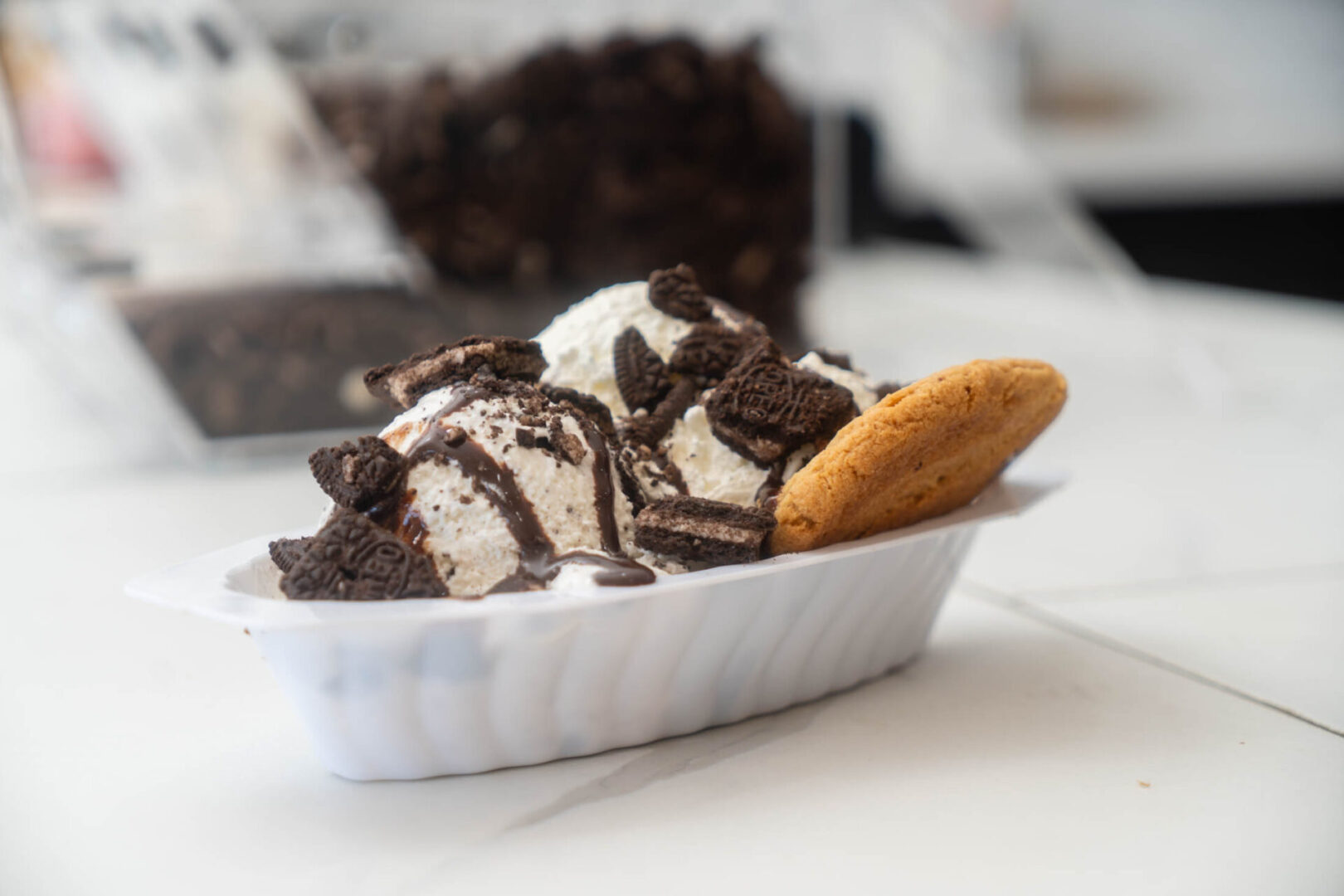 Ice cream with cookies and chocolate drizzle.