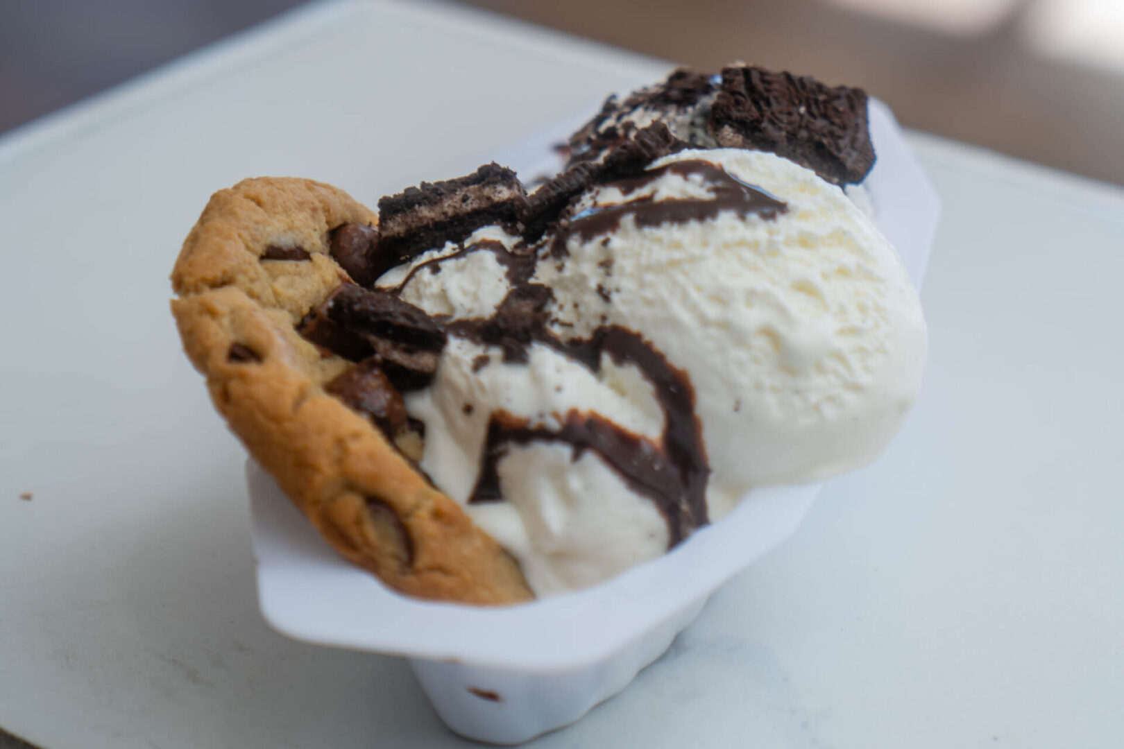 Ice cream sundae with cookie and brownie.
