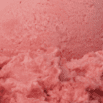 Close-up of pink ice cream texture.