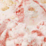 Strawberry swirl ice cream close-up.