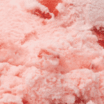 Pink fluffy cotton candy texture close-up.