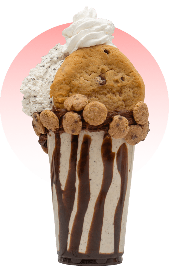 Milkshake with cookies and whipped cream topping.